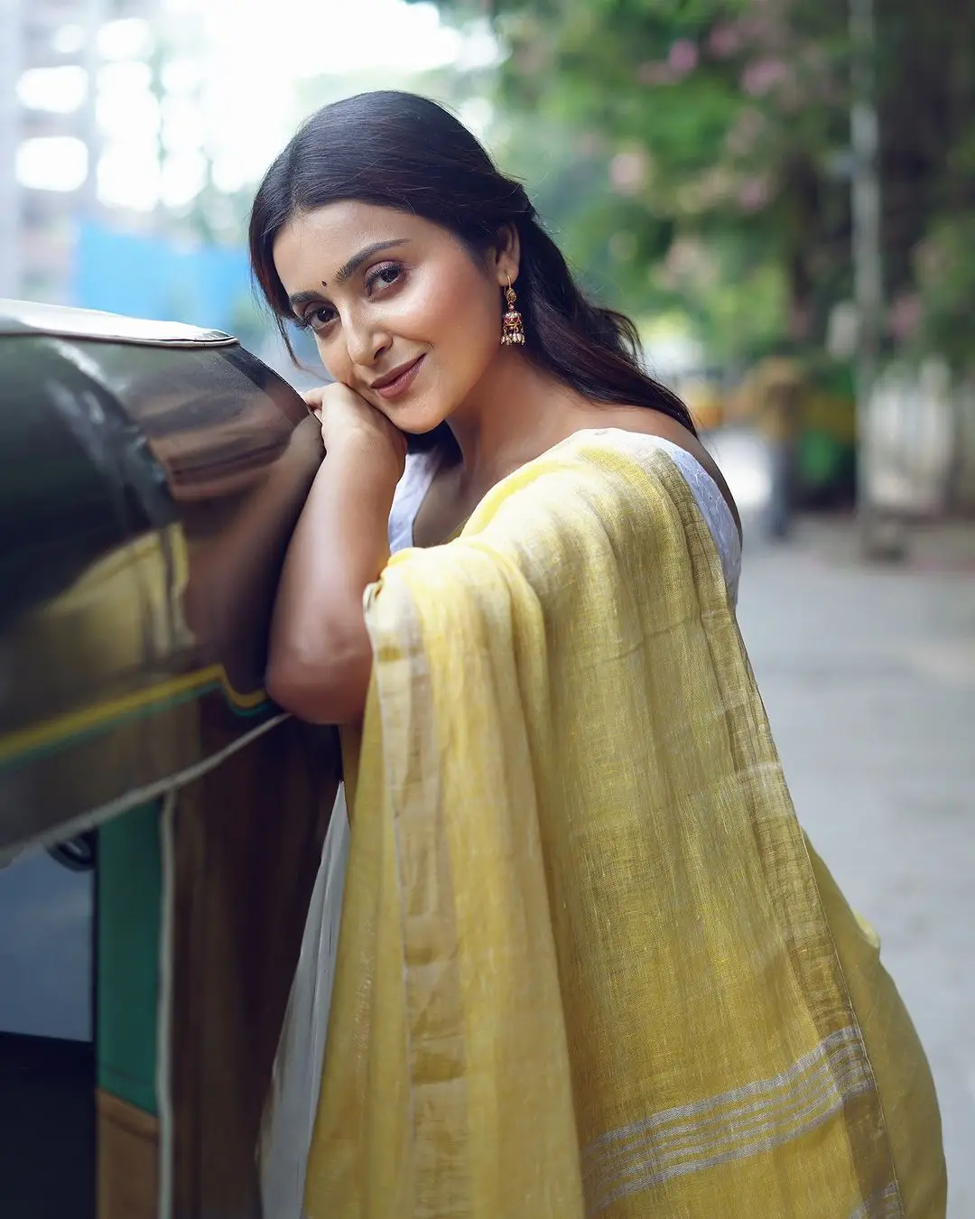 avantika mishra stills in yellow saree white sleeveless blouse